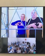 Sergey Zhigalov and Viktor Kudinov attend the hearing via videoconferencing from the detention center