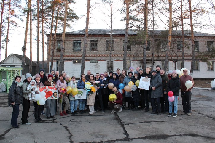 The Goliks surrounded by friends and family