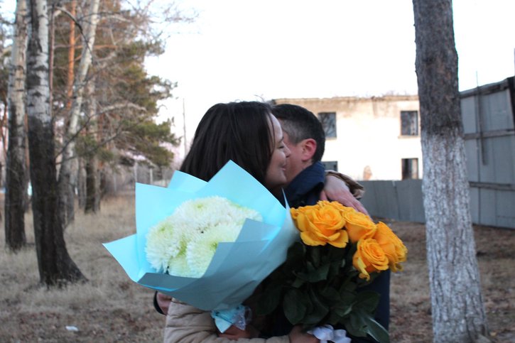 Dmitriy embracing his wife Kristina