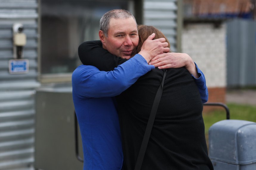 Moscow resident Sergey Tolokonnikov hugs his wife after his release. The court found her guilty for her faith 5 months later. June 2025.
